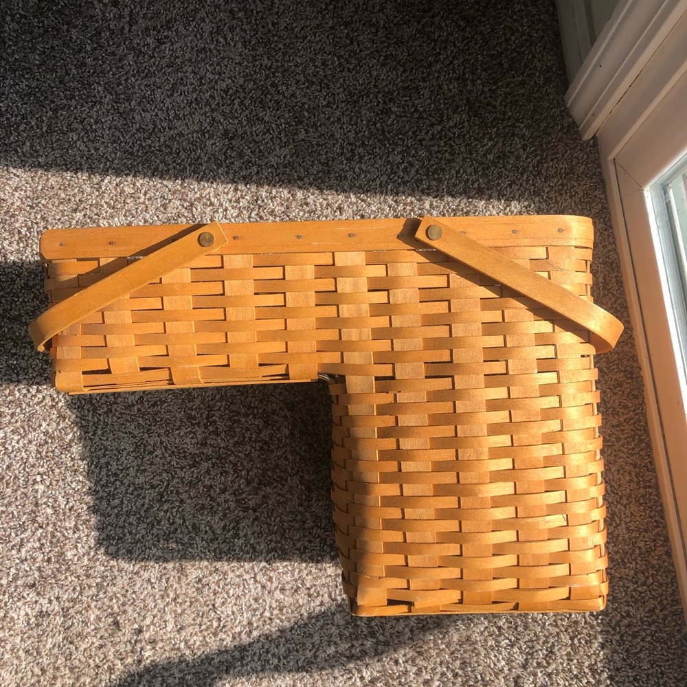 Longaberger Step it up stair basket with plastic liner.